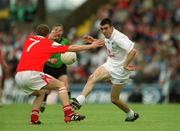 26 May 2002; John Doyle of Kildare in action against John Neary of Louth during the Bank of Ireland Leinster Senior Football Championship Quarter-Final match between Kildare and Louth at Páirc Tailteann in Navan, Meath. Photo by Ray McManus/Sportsfile