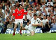 26 May 2002; Anthony Rainbow of Kildare in action against Simon Gerard of Louth during the Bank of Ireland Leinster Senior Football Championship Quarter-Final match between Kildare and Louth at Páirc Tailteann in Navan, Meath. Photo by Ray McManus/Sportsfile