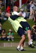 29 May 2002; Lee Carsley gets a lift from his team-mate Gary Kelly during a Republic of Ireland squad training session at Izumo Sports Park in Izumo, Japan. Photo by David Maher/Sportsfile