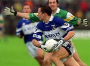 26 May 2002; Tom Kelly of Laois in action against Offaly's Roy Malone during the Bank of Ireland Leinster Senior Football Championship Quarter-Final match between Offaly and Laois at O'Connor Park in Tullamore, Offaly. Photo by Matt Browne/Sportsfile