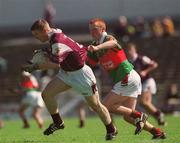 19 May 2002; Kieran McGrath of Galway is tackled by John Prenty of Mayo during the Connacht Minor Football Championship Quarter-Final match between Mayo and Galway at Dr Hyde Park in Roscommon. Photo by Brian Lawless/Sportsfile