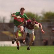 19 May 2002; Shane Moran of Galway is tackled by Dara Sloyne of Mayo during the Connacht Minor Football Championship Quarter-Final match between Mayo and Galway at Dr Hyde Park in Roscommon. Photo by Brian Lawless/Sportsfile