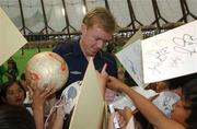 30 May 2002; Republic of Ireland's Steve Staunton signs autographs during a farewell ceremony at Izumo Sports Park in Izumo, Japan, ahead of their first FIFA World Cup 2002 Group E match against Cameroon. Photo by David Maher/Sportsfile