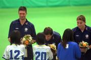 30 May 2002; Republic of Ireland players, from left, Niall Quinn, Gary Breen and Matt Holland receive flowers from local school children during a farewell ceremony at Izumo Sports Park in Izumo, Japan, ahead of their first FIFA World Cup 2002 Group E match against Cameroon. Photo by David Maher/Sportsfile