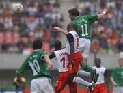 1 June 2002; Kevin Kilbane of Republic of Ireland in action against Cameroon's Geremi, 8, and Lauren during the FIFA World Cup 2002 Group E match between Republic of Ireland and Cameroon at Big Swan Stadium in Niigata, Japan. Photo by David Maher/Sportsfile