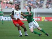 1 June 2002; Robbie Keane of Republic of Ireland in action against Cameroon's Rigobert Song during the FIFA World Cup 2002 Group E match between Republic of Ireland and Cameroon at Big Swan Stadium in Niigata, Japan. Photo by David Maher/Sportsfile