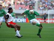 1 June 2002; Robbie Keane of Republic of Ireland in action against Rigobert Song of Cameroon during the FIFA World Cup 2002 Group E match between Republic of Ireland and Cameroon at Big Swan Stadium in Niigata, Japan. Photo by David Maher/Sportsfile