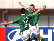 1 June 2002; Republic of Ireland's Matt Holland, right, celebrates with team-mate Robbie Keane after scoring his sides equalising goal during the FIFA World Cup 2002 Group E match between Republic of Ireland and Cameroon at Big Swan Stadium in Niigata, Japan. Photo by David Maher/Sportsfile