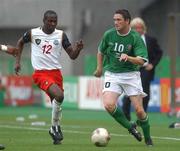 1 June 2002; Robbie Keane of Republic of Ireland in action against Lauren of Cameroon during the FIFA World Cup 2002 Group E match between Republic of Ireland and Cameroon at Big Swan Stadium in Niigata, Japan. Photo by David Maher/Sportsfile