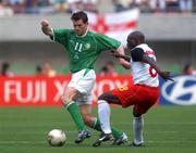 1 June 2002; Kevin KIlbane of Republic of Ireland is tackled by Geremi of Cameroon during the FIFA World Cup 2002 Group E match between Republic of Ireland and Cameroon at Big Swan Stadium in Niigata, Japan. Photo by David Maher/Sportsfile
