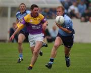 1 June 2002; Shane Ryan of Dublin in action against Wexford's Darragh Breen during the Bank of Ireland Leinster Senior Football Championship Quarter-Final match between Wexford and Dublin at Dr. Cullen Park in Carlow. Photo by Matt Browne/Sportsfile