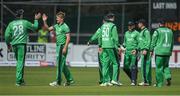 14 May 2017; Barry McCarthy, 2nd from left, of Ireland celebrates taking the wicket of Luke Ronchi of New Zealand during the One Day International match between Ireland and New Zealand at Malahide Cricket Club in Dublin. Photo by Brendan Moran/Sportsfile