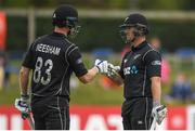 14 May 2017; Neil Broom of New Zealand, right, is congratulated by team-mate Jimmy Neesham after hitting a boundary off a ball from Peter Chase of Ireland during the One Day International match between Ireland and New Zealand at Malahide Cricket Club in Dublin. Photo by Brendan Moran/Sportsfile