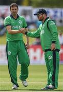 14 May 2017; Tim Murtagh of Ireland is congratulated by team-mate Paul Stirling after taking the wicket of George Worker of New Zealand during the One Day International match between Ireland and New Zealand at Malahide Cricket Club in Dublin. Photo by Brendan Moran/Sportsfile