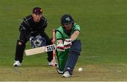 14 May 2017; Andrew Balbirnie of Ireland hits a boundary off Mitchell Santner of New Zealand watched by wicketkeeper Luke Ronchi during the One Day International match between Ireland and New Zealand at Malahide Cricket Club in Dublin. Photo by Brendan Moran/Sportsfile