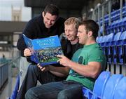 14 November 2011; Leinster players Fergus McFadden, Leo Cullen and Sean O'Brien look through the new Leinster Rugby Book Rhapsody In Blue. The book, which has an RRP of €24.95, is on sale from www.leinsterrugby.ie, www.sportsfile.com and from select bookshops nationwide. Picture credit: Matt Browne / SPORTSFILE