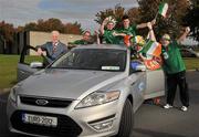 16 November 2011; Rev it up and here we go: Ford, official vehicle supplier to the FAI, celebrated the Republic of Ireland’s qualification for Euro 2012 with manager Giovanni Trapattoni, model Nadia Forde and a group of jubilant Irish fans. Thousands of Irish supporters will take to the road for the tournament in Poland and the Ukraine next summer - Ireland’s first major tournament in ten years. FAI Headquarters, Abbotstown, Dublin. Picture credit: David Maher / SPORTSFILE