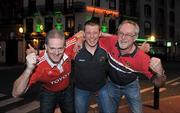18 November 2011; Munster supporters Aidan Hurley, from Carrigaline, Cork, left, along with Paul Wheatley, centre, and John Wheatley, from Cork City, outside Trevor Brennan's De Danu Pub in Toulouse ahead of their side's Heineken Cup, Pool 1, Round 2, match against Castres Olympique on Saturday. Toulouse, France. Picture credit: Diarmuid Greene / SPORTSFILE