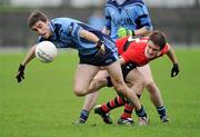 20 November 2011; Richard Power, Moyle Rovers, Tipperary, in action against Stephen O'Brien, UCC, Cork. AIB Munster GAA Football Senior Club Championship Semi-Final, Clonmel Sportsfield, Clonmel, Co. Tipperary. Picture credit: Matt Browne / SPORTSFILE