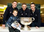 20 November 2011; Dublin players Paul Flynn, Eoghan O'Gara and Kevin Nolan when they signed a copy of the Dublin book  'A Rare Auld Season' for seven year old Adam Heron, from Balbriggan, Co. Dublin, in Easons, O'Connell Street, Dublin. Picture credit: Ray McManus / SPORTSFILE