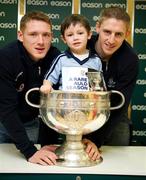 20 November 2011; Dublin players Paul Flynn and Eoghan O'Gara when they signed a copy of the Dublin book  'A Rare Auld Season' for four year old Saul Farrell Fogarty, from Ratoath, Co. Meath, in Easons, O'Connell Street, Dublin. Picture credit: Ray McManus / SPORTSFILE