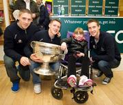 20 November 2011; Dublin players Paul Flynn, Eoghan O'Gara and Kevin Nolan when they signed a copy of the Dublin book  'A Rare Auld Season' for nine year old Chloe Collins, from Sandyford, Co. Dublin, in Easons, O'Connell Street, Dublin. Picture credit: Ray McManus / SPORTSFILE