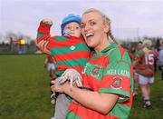 20 November 2011; Shauna McCrystal, Lisnaskea, celebrates with her son Finog McCrystal after the game. Tesco All-Ireland Intermediate Ladies Football Club Championship Final, Lisnaskea v Stabannon, St. Mary’s Park, Scotstown, Monaghan. Photo by Sportsfile