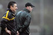 20 November 2011; Kilmurry-Ibrickane, Clare, manager John Kennedy, right, and Dr. Crokes, Kerry, manager Harry O'Neill during the final moments of the game. AIB Munster GAA Football Senior Club Championship Semi-Final, Dr. Crokes, Kerry v Kilmurry-Ibrickane, Clare, Dr. Crokes GAA Club, Killarney, Co. Kerry. Picture credit: Diarmuid Greene / SPORTSFILE