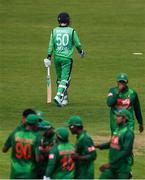 19 May 2017; George Dockrell of Ireland leaves the field as Bangladesh players celebrate during the One Day International match between Ireland and Bangladesh at Malahide Cricket Club in Dublin. Photo by Sam Barnes/Sportsfile