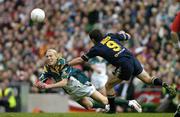24 October 2004; Ciaran McDonald, Ireland, in action against Austinn Jones, Australia. Coca Cola International Rules Series 2004, Second Test, Ireland v Australia, Croke Park, Dublin. Picture credit; Brendan Moran / SPORTSFILE *** Local Caption *** Any photograph taken by SPORTSFILE during, or in connection with, the 2004 Coca Cola International Rules Series which displays GAA logos or contains an image or part of an image of any GAA intellectual property, or, which contains images of a GAA player/players in their playing uniforms, may only be used for editorial and non-advertising purposes.  Use of photographs for advertising, as posters or for purchase separately is strictly prohibited unless prior written approval has been obtained from the Gaelic Athletic Association.