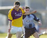 31 May 2006; Greg Jacob, Wexford, in action against Colm Prenderville, Dublin. Leinster Junior Football Championship, Quarter-Final, Dublin v Wexford, Parnell Park, Dublin. Picture credit: Brian Lawless / SPORTSFILE