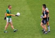 18 September 2011; Classy even in defeat. In a noble gesture Kerry defender Tomás Ó Sé hands the ball to   match-winner Stephen Cluxton. Picture credit; Dáire Brennan / SPORTSFILE