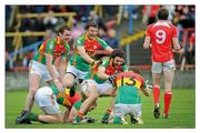 12 June 2011; Rastafarian party mix. Louth discover that sometimes the first year is the one that delivers. Brian Murphy (no. 13) receives the adulation from Thomas Walsh, Brendan Murphy, Kieran Nolan (no. 7) and Shane Redmond (no. 6) as Carlow celebrate a surprise victory. Picture credit; Matt Browne / SPORTSFILE