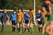 20 November 2011; Referee Liam Devenney, far right, is escorted off the pitch at half time. AIB GAA Football Connacht Senior Club Championship Final, St Brigid's, Roscommon v Corofin, Galway, Kiltoom, Co. Roscommon. Picture credit: David Maher / SPORTSFILE