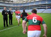 25 November 2011; Gardai John Newton, left, and John Kissane, Chairman of the Garda GAA Club, applaud as members of the PSNI Gaelic Athletic Club take to the field for the start of the McCarthy Cup game. Garda GAA Club (4-17)  v PSNI Gaelic Athletic Club (1-6), Croke Park, Dublin. Picture credit: Ray McManus / SPORTSFILE