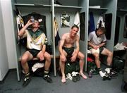 15 October 1999; The victorious Irish, which defeated Australia pictured in the dressing room in Adelaide. From left, John McDermott rehydrates. Trevor Giles smiles. Sean Og de Paor winches as he tugs at the strapping on his right leg. International Compromise Rules, Australia. Picture credit; Ray McManus/SPORTSFILE