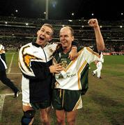 8 October 1999; Ireland players Seán Óg De Paor, left, and Peter Canavan, right, celebrate victory over Australia in the first Test at the Melbourne Cricket Grounds, Melbourne, Australia. International Rules. Picture credit, Ray McManus/SPORTSFILE