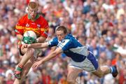 30 May 2004; Cormac McCarthy, Carlow, in action against Chris Conway, Laois. Bank of Ireland Leinster Senior Football Championship, Carlow v Laois, Dr. Cullen Park, Carlow. Picture credit; David Maher / SPORTSFILE