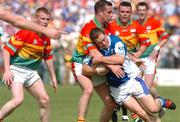 30 May 2004; Chris Conway, Laois, in action against Joe Byrne, Carlow. Bank of Ireland Leinster Senior Football Championship, Carlow v Laois, Dr. Cullen Park, Carlow. Picture credit; David Maher / SPORTSFILE