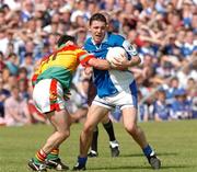 30 May 2004; Ian Fitzgerald, Laois, in action against Johnny Nevin, Carlow. Bank of Ireland Leinster Senior Football Championship, Carlow v Laois, Dr. Cullen Park, Carlow. Picture credit; David Maher / SPORTSFILE