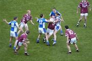 18 July 2004; Rory O'Connell, Westmeath, is tackled by Chris Conway, 12 and Noel Garvan, Laois. Bank of Ireland Leinster Senior Football Championship Final, Laois v Westmeath, Croke Park, Dublin. Picture credit; Ray McManus / SPORTSFILE