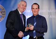 25 November 2011; Referee David Goldrick, from Meath, is presented with his Sigerson Cup referees' award by Uachtarán CLG Criostóir Ó Cuana. 2011 National Referees' Awards Banquet, Croke Park, Dublin. Picture credit: Barry Cregg / SPORTSFILE