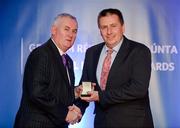 25 November 2011; Referee Brian Gavin, from Offaly, is presented with his GAA Hurling All-Ireland Senior Championship referees' award by Uachtarán CLG Criostóir Ó Cuana. 2011 National Referees' Awards Banquet, Croke Park, Dublin. Picture credit: Barry Cregg / SPORTSFILE