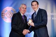 25 November 2011; Referee Brian O'Shea, from Dublin, is presented with his AIB GAA Football All-Ireland Junior Club Championship referees' award by Uachtarán CLG Criostóir Ó Cuana. 2011 National Referees' Awards Banquet, Croke Park, Dublin. Picture credit: Barry Cregg / SPORTSFILE