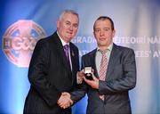 25 November 2011; Referee Eddie Kinsella, from Laois, is presented with his GAA All-Ireland Football U21 Championship referees' award by Uachtarán CLG Criostóir Ó Cuana. 2011 National Referees' Awards Banquet, Croke Park, Dublin. Picture credit: Barry Cregg / SPORTSFILE