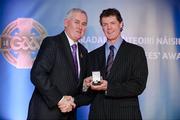 25 November 2011; Referee Tony Carroll, from Offaly, is presented with his International Games 2011 for Hurling/ Shinty referees' award by Uachtarán CLG Criostóir Ó Cuana. 2011 National Referees' Awards Banquet, Croke Park, Dublin. Picture credit: Barry Cregg / SPORTSFILE