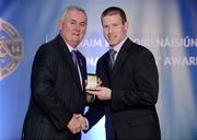 25 November 2011; Referee Padraig Hughes, from Armagh, is presented with his Football Minor Championship referees' award by Uachtarán CLG Criostóir Ó Cuana. 2011 National Referees' Awards Banquet, Croke Park, Dublin. Picture credit: Barry Cregg / SPORTSFILE