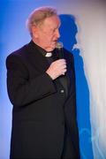 25 November 2011; Fr. Seamus Gardiner being interviewed on stage by Master of Ceremonies Marty Morrissey. 2011 National Referees' Awards Banquet, Croke Park, Dublin. Picture credit: Barry Cregg / SPORTSFILE