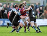 26 November 2011; Sam Cronin, Clontarf, is tackled by Stephen Keogh and Tadgh Bennett, right, Shannon. Ulster Bank League Division 1A, Clontarf v Shannon, Castle Avenue, Clontarf, Dublin. Picture credit: Matt Browne / SPORTSFILE