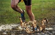 27 November 2011; An athlete makes his way through the mud during the senior men's race at the Woodie’s DIY Inter County Cross Country Championships. Sligo Racecourse, Sligo. Picture credit: Pat Murphy / SPORTSFILE